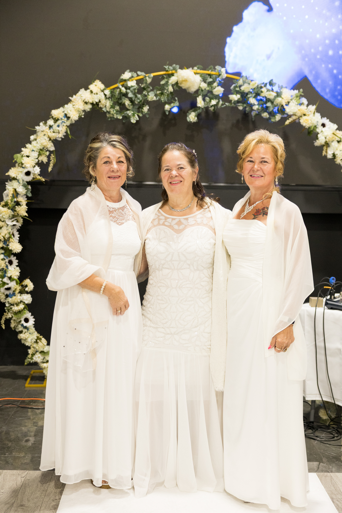 Women standing by archway